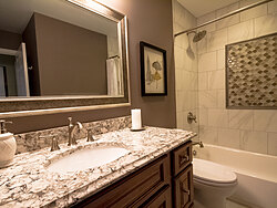 Small Bathroom With Decorative Tile - Countertop