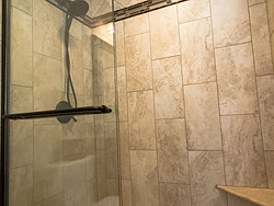 Small Bathroom With Decorative Tile - Shower Detail