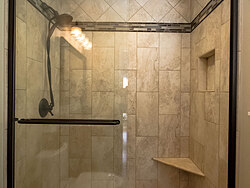Small Bathroom With Decorative Tile - Glass Shower