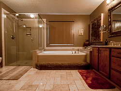 Warm Bathroom With Glass Shower - Remodeling