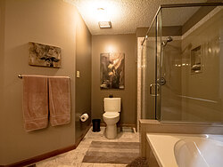 Warm Bathroom With Glass Shower - Toilet