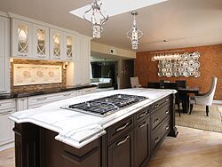 White Kitchen With Marble Island - Stovetop