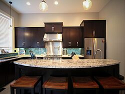 Contemporary Kitchen With Accent Wall - Island Countertop