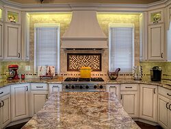 White Kitchen With Accent Island - Stovetop