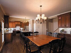 Traditional Kitchen With Center Island - Wood Floors