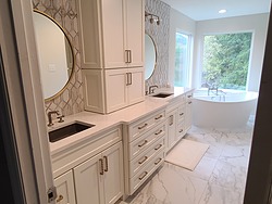 White marble bathroom with gold accents