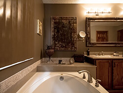 Warm Bathroom With Glass Shower - Bath Tub
