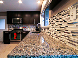 Contemporary Kitchen With Mosaic Backsplash - Granite Countertop