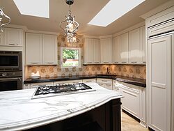 White Kitchen With Marble Island Design