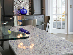 Contemporary Kitchen With Glass Accents - Island Granite Countertop