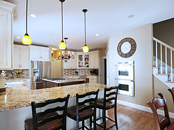Transitional Kitchen With Accent Island